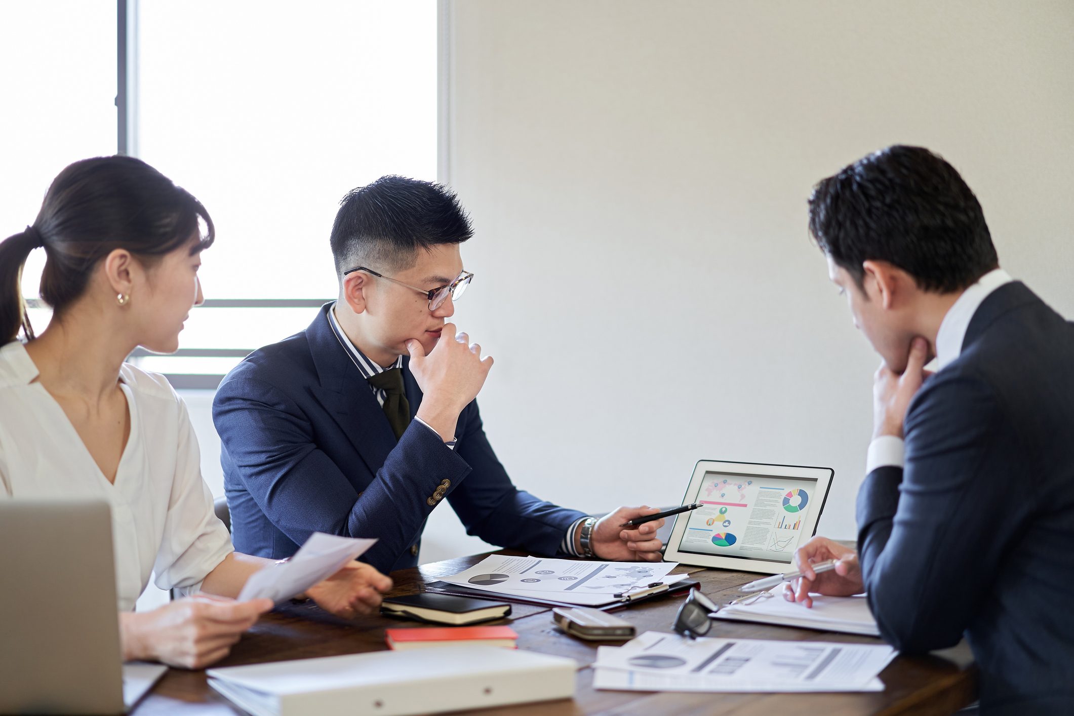 A business person who holds a meeting about a business plan